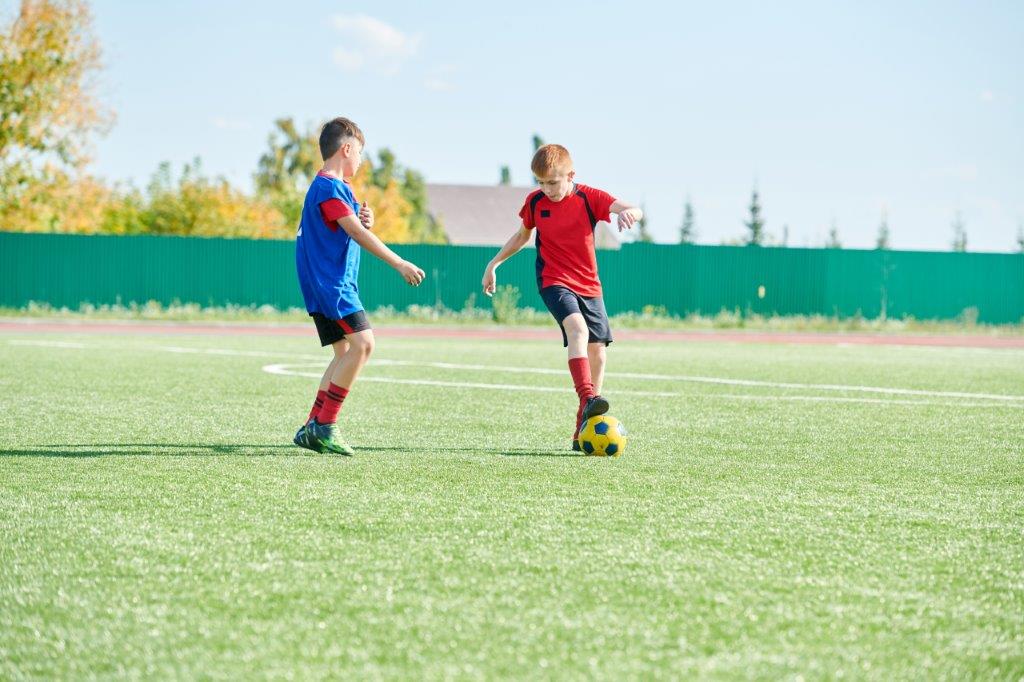 children training soccer